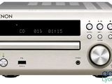 the denon cd player has a cd player on top of it