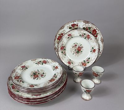 a lot of plates and cups sitting on a table