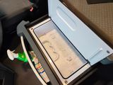 a cooler with toothbrushes and toothpaste in it