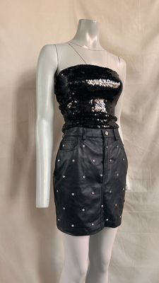 black sequinned strapless dress on mannequin mannequin mannequin mannequin mannequin mannequin mannequin mannequin