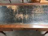 a table that has a black top and a brown top