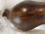 a pear sitting in a plastic bag on a table