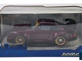 the box is open to show the purple car in it ' s packaging