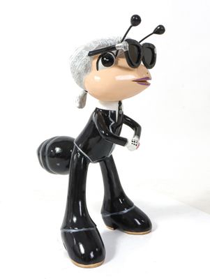 an image of a figurine of a woman in a suit and sunglasses