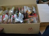 someone is holding a box full of different types of food