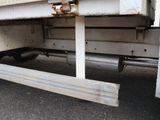 a white truck that has a flat bed on the back