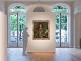a large painting on the wall in a large room