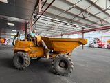 a large yellow dump truck parked in a parking lot