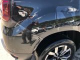 a reflection of a man on the side of a car