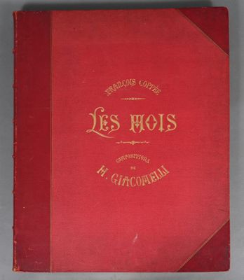 a red book sitting on top of a white table