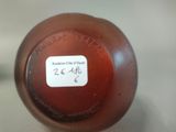 a bottle with a label on it sitting on a table