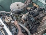 a close up of a car ' s engine in the back of it
