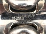 a close up of a metal object with a name on it