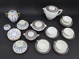 many different types of tea cups and saucers on the table