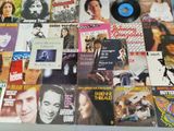 many different types of vinyl records on the table