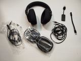 a pair of headphones and a charger on a table