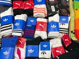 many pairs of socks that are sitting on a table