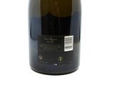 a bottle of wine that is sitting on a table