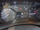a close up of a car dashboard with a speedometer and gauges