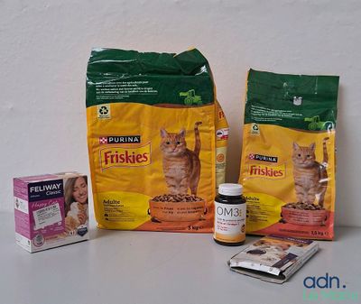 two bags of cat food and two packages of cat food