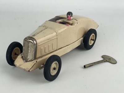 a toy car with a key on the side of it