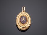 a gold and amethorate locke with a star in the center