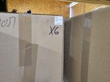 two boxes that are sitting on the floor next to each other
