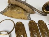 a lot of brass items that are on a table