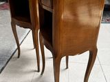 pair of wooden chairs with drawers on each of them in a living room