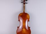 an antique violin with a wooden back and bow on a white background