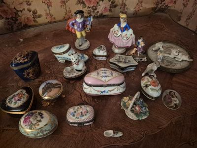 many different types of porcelain figurines sitting on a table