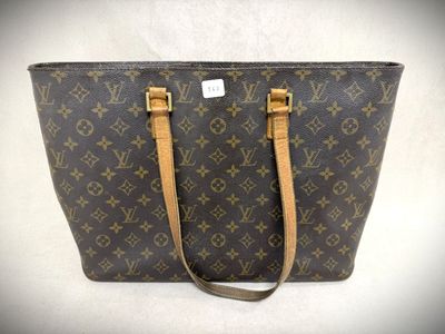 a louis vuitton handbag on a white background