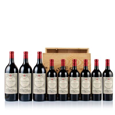 un lot de six bouteilles de vin rouge devant une caisse en bois