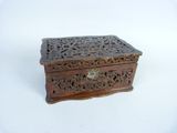 an old wooden box sitting on top of a white surface
