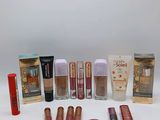 the contents of a variety of makeup products are arranged on a white surface