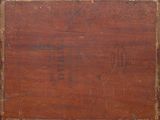 an old wooden box with writing on it sitting on a table