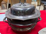 a red table cloth with silver objects on it