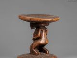 a small wooden table with a wooden top and a wooden base