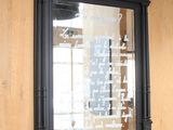 a mirror hanging on the wall with writing on it
