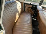 two seats in the back of a car that is empty