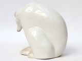 an image of a white ceramic sculpture of a polar bear