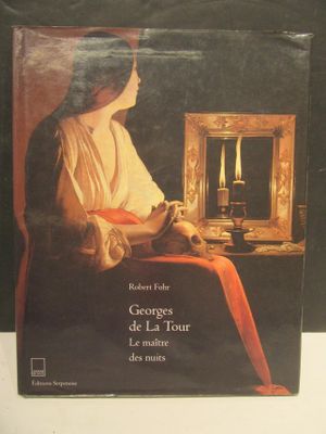 a book with a picture of a woman sitting in front of a mirror