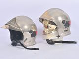 two helmets that are sitting next to each other on a table