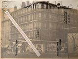 une vieille photo d'un immeuble situé à l'angle d'une rue