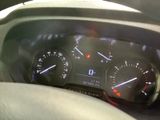 a close up of a car dashboard with a speedometer and gauges