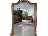 a mirror that is sitting on the floor in a room