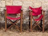 a lot of chairs that are sitting in the grass