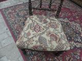 a chair that is sitting on a rug on the floor