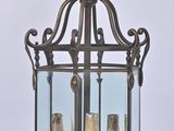an old fashioned lantern with three candles inside of it on a white background