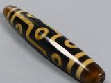 an image of a pen with a black and gold design